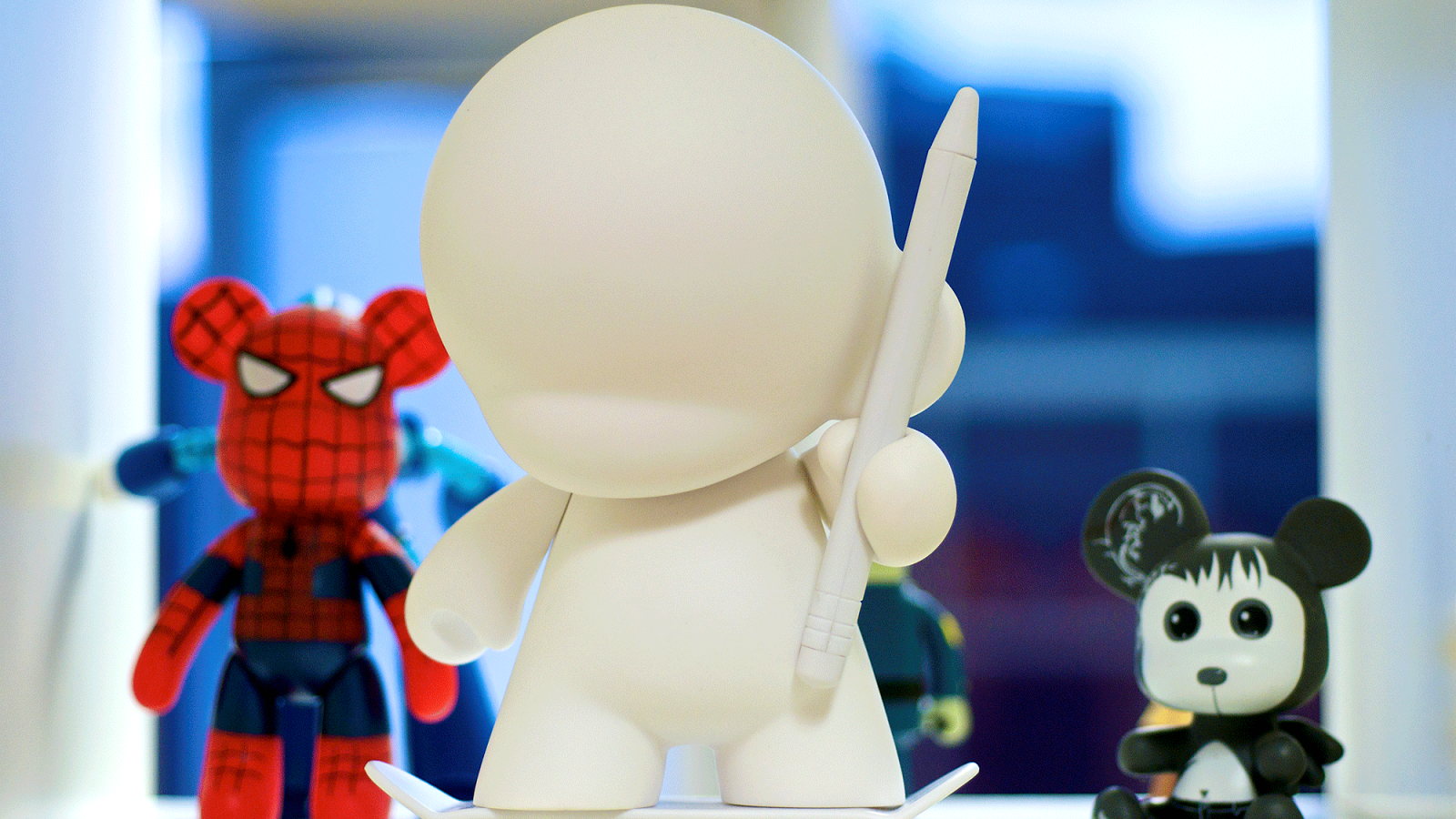 3x toys sitting pretty on a shelf